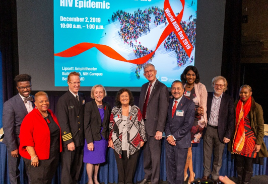 Left to right: Daniel Driffin, Pernessa C. Seele, CAPT Timothy H. Holtz, Dr. Maureen M. Goodenow, Jeanne White-Ginder, Dr. Francis S. Collins, Guillermo Chacon, Marissa Miller, Mitchell Warren, and Abby R. Charles. 